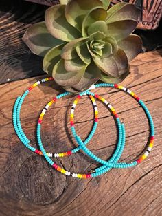 This stylish Serape Wrap Bracelet ~ Turquoise is a dainty western-inspired piece that's handcrafted by a small business in the USA. Featuring serape beads that wrap around your wrist, it's a unique and fashionable accent for any outfit. Wear alone or stack with other colors to make the perfect western stack. Shown with our Laney Earrings Artisan Turquoise Hand Wrapped Wrap Bracelet, Artisan Hand Wrapped Turquoise Wrap Bracelet, Hand-strung Heishi Bead Bangle, Turquoise Wrap Bracelet With Colorful Beads, Turquoise Hand Wrapped Bracelets For Festivals, Hand Wrapped Turquoise Friendship Bracelets For Festival, Southwestern Hand Wrapped Adjustable Jewelry, Southwestern Adjustable Hand Wrapped Jewelry, Adjustable Southwestern Hand Wrapped Jewelry