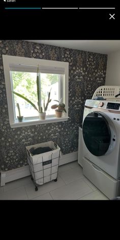 a washer and dryer in a small room