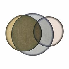 three circular rugs with different colors and sizes on the top one is green, beige, and white