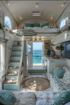 the interior of a tiny house with stairs leading up to the bed