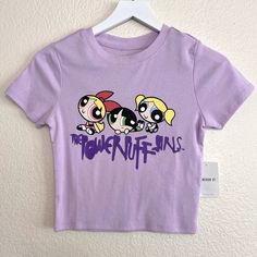 Forever 21 The Powerpuff Girls Graphic Tee Size Small Light Purple Lavender Lilac Graffiti Print Logo Blossom Bubbles And Buttercup Short Sleeve Crew Neck Semi Cropped Super Soft Powerpuff Girls Merch Is Hard To Find. Grab This Exclusive T-Shirt And Soak Up The Nostalgia Of Vintage Y2k Cartoon Network Brand New With Tags Make Me An Offer Trendy Purple Top With Graphic Print, Cute Purple Top With Graphic Print, Trendy Purple Tops With Letter Print, Cute Purple Tops With Character Print, Purple Cartoon Print Tops For Spring, Cute Purple Top With Letter Print, Purple Cotton Tops With Cartoon Print, Playful Purple Tops With Cartoon Print, Purple Y2k Crew Neck Top