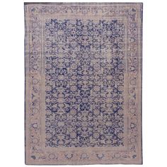 an antique persian rug with blue and beige colors, on a white background the area is very