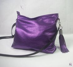 SOFT METALLIC PURPLE leather Purse bag with Leather Tassel HANDMADE in Australia * Bag opens all the way across the top * 2 inside pockets including zipper pocket * 1 outside zipper pocket * Strong metal zip closure with leather zipper pull * Quality strong hardware * Riveted black Metallic Leather Bag, Purple Purse, Handmade Leather Bags, Purple Bag, Metallic Purse, Antique Brass Hardware, Purple Love, Tassel Bag, Metallic Bag