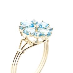 Item: 2222 Description 14k. Solid Gold Ring With Natural Blue Topaz (Yellow Gold) Original Ring Size 8.50 (More Upon Request) A 14 Karat Gold Ring Featuring A Vibrant Blue Topaz Styled In A Blossomed Flower Item Information Metal: 14k. Solid Gold Metal Weight: 3.20 Gr. Gemstones 4 Pear Shape, 6x4 Mm, Blue Topaz = 1.63 Ct 4 Round Shape, 3.0 Mm, Blue Topaz = 0.80 Ct Measurements Height: 0.99 In ( 25.1 Mm) Width: 0.55 In ( 14 Mm) Yellow Gold Rings With Blue Topaz And 17 Jewels, Yellow Gold Blue Topaz Ring Fine Jewelry, 14k Stamped Yellow Gold Topaz Ring, Yellow Gold Blue Topaz Ring With Prong Setting, Yellow Gold Blue Topaz Birthstone Ring, Topaz Yellow, Topaz Color, Solid Gold Ring, Solid Gold Rings