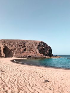 there is a rock outcropping on the beach