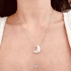 This elegant crescent moon pendant necklace features a crescent moon shape moonstone with blue flash, on solid 925 sterling silver cable chain and platinum plating. Add this elegant crescent moon moonstone pendant necklace to your everyday fine jewelry collection or as gift for your loved ones. Pendant dimensions: 0.68 x 0.48 inNecklace length: 17.5 in with the adjustable ballMaterials: moonstone, 925 sterling silver Jewelry Care: See more information about how to care for your jewelry here. Shipping Policy: Orders will be shipped within 1-3 business days. Economy shipping will take 7-14 days to arrive and standard shipping is 1- 4 days for U.S. orders. International shipping time is depended on the country and per shipping method. Shipping cost will be calculated at check out.For more det Elegant Silver Crystal Necklace With Moon Phase, Silver Crystal Necklace With Moon Phase In Moonstone, Silver Sterling Silver Moon Crystal Necklace, Silver Half Moon Moonstone Jewelry, Silver Crescent Crystal Necklace In Celestial Style, Silver Moonstone Crystal Necklace With Moon Phase, Silver Crystal Necklace With Moon Charm, Silver Crescent Crystal Necklace Celestial Style, Silver Moonstone Necklace With Moon Phase Detail