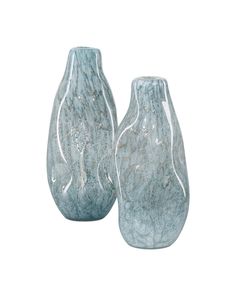 two blue vases sitting next to each other on a white background, one is empty