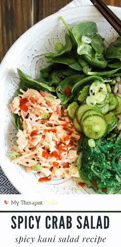 a white plate topped with salad and chopsticks