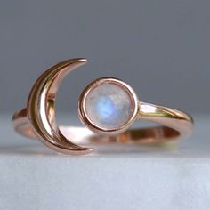 "Crescent Moon Ring with Moonstone, Raw Gemstone Moon Ring, Moon Goddess Jewelry, Celestial Rings, Sterling Silver, Rose Gold, Planet What a perfect way to say \"I love you to the Moon and back\". This dainty little moon ring is hand crafted out of 925 sterling silver with three options for plating (rose gold vermeil, Gold vermeil and sterling silver). Each natural rainbow moonstone is hand selected. I only use stones that have blue flash when the light hits. Since the ring is a sterling silver Moon Goddess Jewelry, Moon Phase Ring, Blush Jewelry, Planet Ring, Ring Moon, Crescent Moon Ring, Celestial Ring, Raw Gemstone Jewelry, Goddess Jewelry