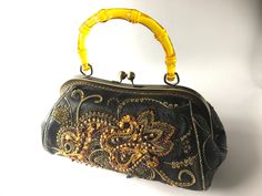 Leather handbag decorated with embroidery with beads, gold thread, natural amber. The handle is made of durable plastic, amber color. Bronze metal lock  This handbag created with love, attention is paid to every detail. Ideal for an evening dress, for special events.    MEASUREMENTS: Height: 16,5 cm=6,4 inch Width: 14 cm=5,5 inch Lengh: 28 cm=11 inch Size is approximate, may vary slightly. This handbag comes to you nicely packed in a  solid box.  Great elegant gift for women! Recommended dry cleaning and careful handling. Embroidery With Beads, Embroidered Leather, Color Bronze, Natural Amber, Bronze Metal, Gold Thread, Amber Color, Gold Threads, Louis Vuitton Speedy Bag