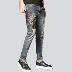 Indian head embroidery men's jeans online—cool jeans from the 2023 Spring-Summer collection. With street fashion, you can be sure that your outfit reflects your personality and values. Street-style denim clothes offer a unique look that allows you to express your individuality and stand out. Street-style denim clothing is comfortable and versatile, allowing you to mix and match different pieces to create unique looks. This clothing style is also easy to customize, so you can stay on trend withou Embroidered Straight Leg Jeans For Streetwear, Embroidered Denim Blue Jeans For Streetwear, Spring Embroidered Jeans For Streetwear, Embroidered Cotton Jeans For Streetwear, Graphic Print Denim Jeans For Fall, Fall Graphic Print Denim Jeans, Winter Streetwear Jeans, Winter Distressed Cotton Jeans, Street Mode