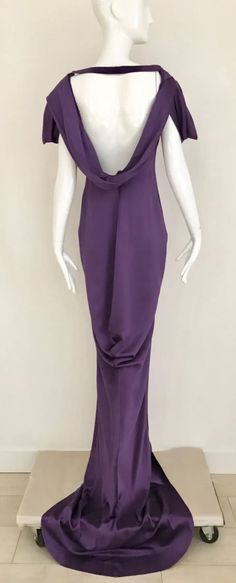 For Sale on 1stdibs - Stunning Alexander McQueen Purple violet silk charmeuse gown with interesting sleeves and exposed bare back. Slightly cowl neck. strap can be removed. Alexander Mcqueen Silk Dress, Pre-draped Floor-length Silk Evening Dress, Pre-draped Cowl Back Maxi Dress For Evening, Silk Evening Dress With Bias Cut And Draped Design, Silk Evening Dress With Bias Cut And Draped Style, Silk Evening Dress With Bias Cut Draping, Silk Draped Evening Dress With Bias Cut, Silk Bias Cut Draped Evening Dress, Floor-length Pre-draped Silk Evening Dress