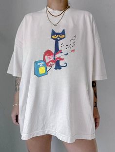 heavy cotton graphic oversized tee with pete the cat playing guitar design on it ! Etsy Graphic Tees, Cute Cat Shirt, Graphic Tees Oversized, Cool Oversized Shirts, Baggy Graphic Tees, Graphic Tees Diy, Cute Merch Ideas, T Shirt Style Ideas Outfit, Cute Etsy Finds