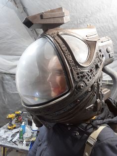 a man wearing a space suit and helmet