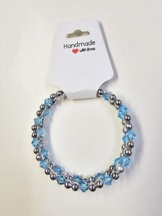 Elevate your style with our stunning light blue and silver wrap bracelet, a perfect accessory for women who appreciate unique jewelry. This boho-inspired leather bracelet features beautiful gemstones and seed beads in shades of light blue, creating a chic and elegant look. The addition of silver beads adds a touch of sophistication to this eye-catching piece. Whether you're dressing up for a special occasion or simply want to add a pop of color to your everyday outfit, this memory wire bracelet is versatile and easy to wear. Make a fashion statement with this beaded leather wrap that combines crystal elements with sapphire accents for a one-of-a-kind bracelet that will surely turn heads. Blue Hand Wrapped Crystal Bracelet As Gift, Adjustable Light Blue Bracelets With Faceted Beads, Light Blue Faceted Beads Bracelet For Gift, Light Blue Faceted Beads Bracelets As Gift, Light Blue Adjustable Bracelet With Faceted Beads, Light Blue Faceted Beads Bracelet As A Gift, Adjustable Light Blue Bracelet With Faceted Beads, Adjustable Light Blue Crystal Bracelet For Gift, Adjustable Turquoise Crystal Bracelet With Silver Beads