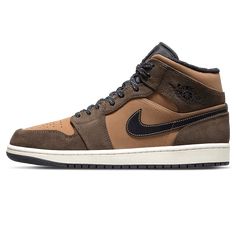 This mid-top Air Jordan 1 comes replaces its usual leather build for full suede materials. Its entire upper sports a mix of dark and light Brown tones with Black Swooshes, plush sockliner, nylon tongues and matching rubber outsole. Trail-styled speckled laces with 3M reflective detailing in the rear atop a Sail midsole completes the design. Brown Color Schemes, Air Jordan 1 Mid Se, 3m Reflective, Nike Swoosh Logo, Nike Air Jordan 1 Mid, Streetwear Shop, Dark Chocolate Brown, Nike Air Jordan 1, Air Jordan 1 High