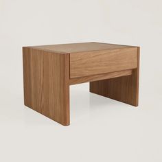 a small wooden table with one drawer open