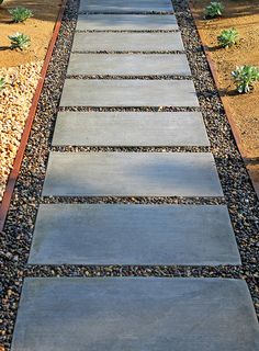 a walkway made out of stones and gravel