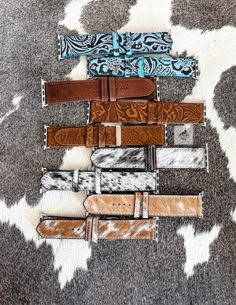 These are our genuine leather watch bands. Choose from 38/40mm or 42/44mm. Compatible with Apple iWatch.  *Note for the cowhide bands: Because these are genuine cowhide no 2 bands will be alike. You will receive a variation of the style you choose. Please message us if would like to see the current options. Click here to be taken to our other bracelets: https://www.etsy.com/shop/CactusAndCoralInc?section_id=12465580 Click here to be taken to our Western chokers: https://www.etsy.com/shop/CactusAndCoralInc?section_id=39808176 Join us to be notified of new releases and exclusive discounts!  https://linktr.ee/cactusandcoral Thank you for stopping by. Have a blessed day! Sincerely, The Cactus and Coral Crew Apple Watch Bands Western, Western Watch Bands, Western Apple Watch Bands, Western Apple Watch Band, Western Chokers, Western Apple Watch, Tooled Leather Phone Case, Leather Strap Watch Women, Chevy Accessories