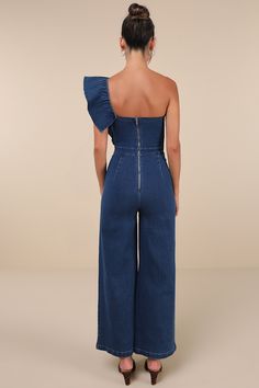 Show up feeling cute and confident in the Lulus Fabulous Effect Blue Chambray One-Shoulder Wide-Leg Jumpsuit! Stretchy chambray fabric shapes this iconic jumpsuit that has a one-shoulder neckline supported by a wide elasticized strap with a wide band of ruffled flounce trim. Bodice boasts hidden no-slip strips and a flattering seamed design. A high, banded waist tops wide legs that finish at ankle-length hems. Exposed zipper/clasp at back. Fit: This garment fits true to size. Length: Ankle lengt Summer Strapless Jumpsuit In Medium Wash, Fitted Denim Blue Strapless Jumpsuit For Summer, Chic Blue Denim Jumpsuit For Summer, Chic Cotton Strapless Jumpsuit For Spring, Chic Strapless Cotton Jumpsuit For Spring, Chic Denim Blue Strapless Jumpsuit For Spring, Chic Medium Wash Overall Jumpsuits And Rompers, Chic Denim Jumpsuit For Spring Party, Fitted Strapless Denim Jumpsuit For Spring