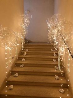 the stairs are decorated with balloons and streamers for an elegant entrance to your home