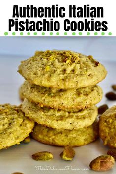 some cookies stacked on top of each other with pistachio and almonds in the background