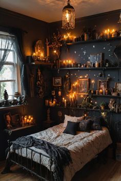 a bedroom decorated in black and gold with candles on the shelves above the bed, along with other decorations