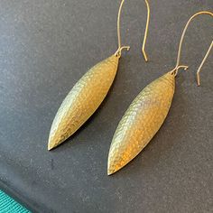 Elegant Textured Brass Jewelry, Artisan Yellow Gold Hammered Earrings, Bronze Hammered Teardrop Earrings, Artisan Hammered Yellow Gold Earrings, Hammered Bronze Teardrop Earrings, Elegant Hammered Bronze Earrings, Traditional Brass Hammered Earrings, Artisan Gold Oval Earrings, Bronze Hammered Teardrop Jewelry