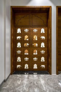 an ornate wooden door with glass inserts