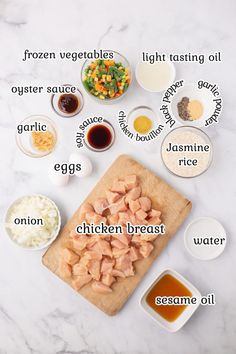 ingredients to make chicken broth laid out on a marble counter top with the words