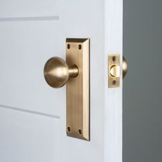 an open door with a brass handle on it