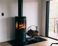 a living room with a wood burning stove in it