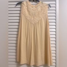 Light Yellow Sleeveless Tunic, Medium, Nwot Sleeveless Summer Vest With Lace Trim, Sleeveless Lace Trim Summer Vest, Sleeveless Lace Trim Vest For Spring, Sleeveless Lace Trim Tank Top, Sleeveless Tank Top With Lace Trim, Bohemian Flowy Sleeveless Tank Top, Flowy Bohemian Sleeveless Tank Top, Spring Sleeveless Tank Top With Lace Trim, Flowy Sleeveless Tank Top For Spring