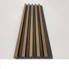 some black and brown wood planks on a white surface