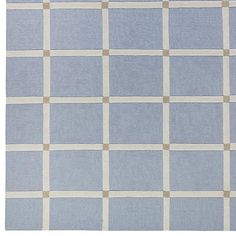 a blue and white rug with squares on it