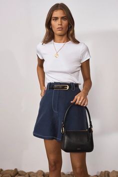 The Telese shorts will make a great addition to the warm-weather section of your capsule wardrobe. Featuring an understated contrast stitch detail, they're made from 100% Cotton that holds its shape well, they're cut for a slightly loose fit and sit high on the waist. Style them with everything from T-shirts to blouses. Features High waisted Mid-thigh length Loose fit Wide belt loops Fully lined Side and back pockets Classic fly front Fabrications 35% Cupro, 30% Tencel, 35% Linen Gentle hand was High Contrast Outfits, Contrast Outfit, Custom Tissue Paper, Gold Foil Logo, Pink Gift Box, Floaty Dress, Of Outfits, Tailored Pants, High Contrast