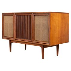 an old style radio cabinet with two doors