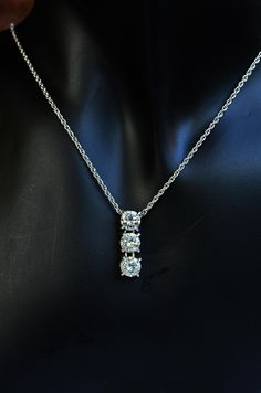 "Sterling silver CZ diamond pendant necklace setting with cubic zirconia first grade.  Trilogy silver pendant. Heart & Arrow diamond CZ superb grade.  Dainty dangling three piece diamond pendant made of sterling silver and plating with rhodium on silver for shiny and elegance look.   The pendant comes with option sterling silver double cable chain 16\", 18\" and more.  Nice and sturdy chain for everyday wearing. Materials   :  sterling silver, cubic zirconia, rhodium Chain         :  sterling silver double cable chain plating with rhodium Dimension  :  CZ 6.5mm x 3 pieces, Pendant 2.2 x 0.7 cm Weight        :   chain 2.6-3 grams <> All items come in individually gift box. It is ready to send as a gift for your special person. <> GIFT PURPOSES - We can also include a little card with a mess Sterling Silver Three Stone Necklace For Anniversary, Three Stone Cubic Zirconia Fine Jewelry Necklaces, Anniversary Three Stone Cubic Zirconia Necklaces, Silver Three-stone Necklaces For Anniversary, Silver Three Stone Necklace, Fine Jewelry Style, Fine Jewelry Silver Necklace With Three Stones, Silver Three Stone Necklace In Fine Jewelry Style, Elegant Three Stone Cubic Zirconia Necklace, Formal Three Stone Cubic Zirconia Necklace