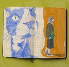 an open book with a drawing of a cat and a man standing next to it