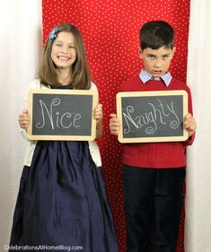 two children are holding up signs that say nice and nighty in front of them