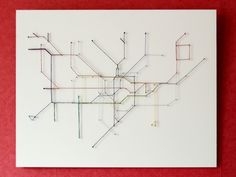 a piece of art that looks like a subway map with lines going through the center