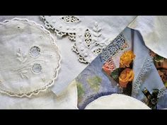 several different types of embroidered cloths and doily with flowers in the center, on top of each other