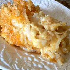 a close up of a plate of food with macaroni and cheese on it