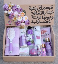 an open box filled with beauty products and flowers