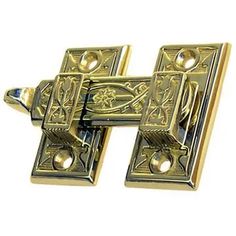 a pair of brass door handles with decorative designs on the front and back sides,