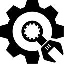 a black and white image of a wrench on top of a cogwheel