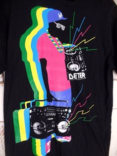 Black retro graphic tshirt/boom box radio tee/90s graphic tshirt Measurements...taken flat -marked size: large -chest: 19"  -length: 29"  Features... -lightweight black cotton -awesome retro graphic print -Deter Condition... -excellent condition -no flaws to note TCC810 90s Inspired Black T-shirt With Graphic Print, 90s Inspired Black Graphic T-shirt, 90s Inspired Black Graphic Print T-shirt, 90s Vintage Print Black T-shirt, 90s Inspired Graphic Print T-shirt For Fans, 90s Style Screen Print T-shirt, 90s Inspired Streetwear T-shirt With Screen Print, Retro Graphic Tops For Music Festivals, Vintage Graphic Design T-shirt For Music Festivals