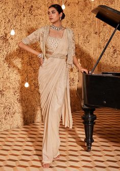 Nidhika Shekhar-Golden Draped Sari And Cape Set-INDIASPOPUP.COM Saree Cape, Gold Organza, Golden Gown, Cape Set, Fancy Sarees Party Wear, Modern Saree, Vacuum Storage, Drape Saree, Blouse Silk