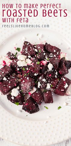 a white plate topped with beets and feta