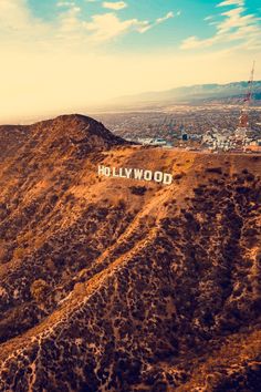 an aerial view of the hollywood sign and mountains with text that reads, los angeles check the best flight prices